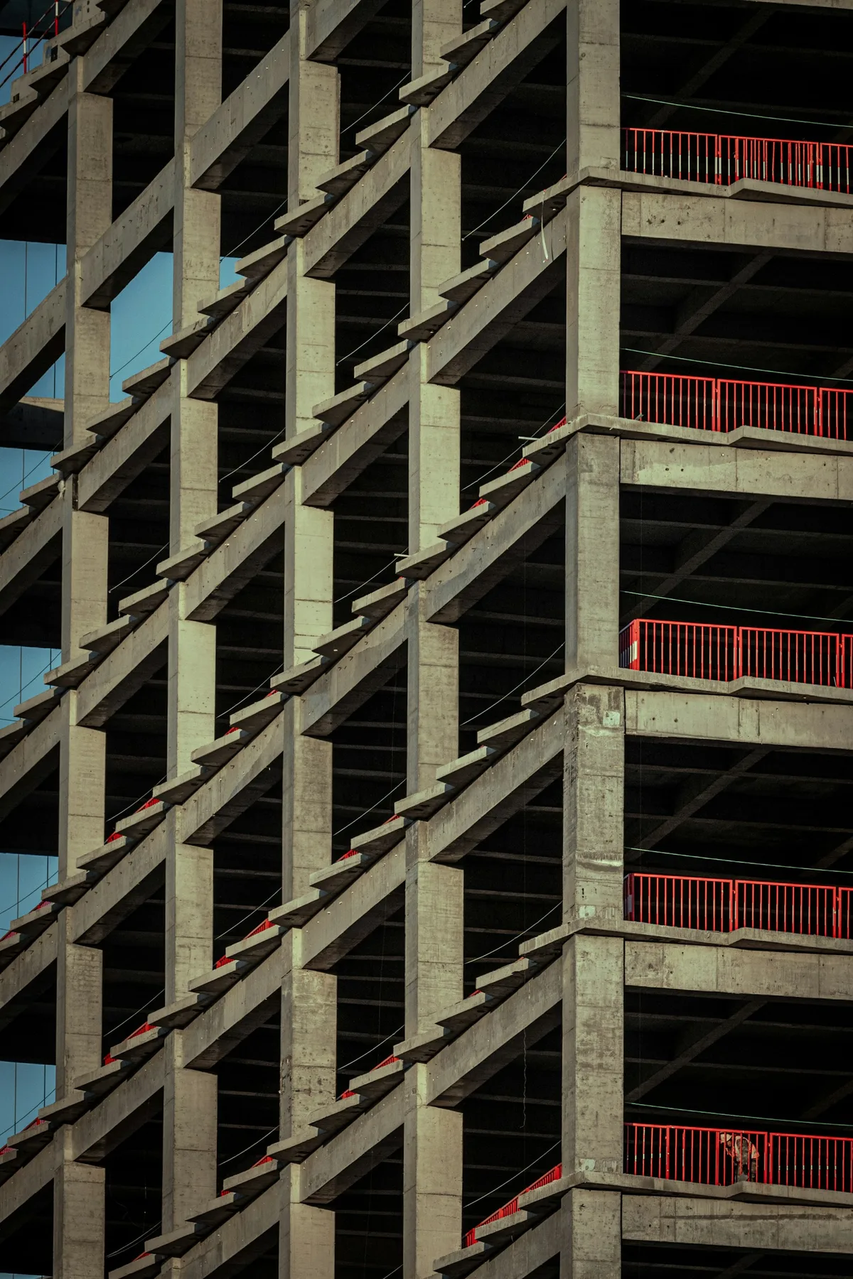 Concrete beams, columns and slabs forming a building frame.
